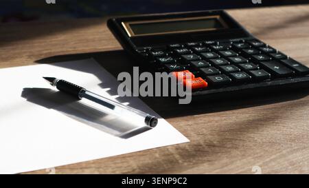 Calculator and pencil. Office desk table with supplies. Flat lay Business workplace and objects. Copy space for text Stock Photo