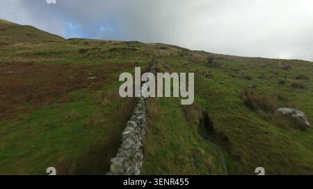 Snowdon Ranger Path FPV Aerial Over Welsh Highlands. Stock Photo