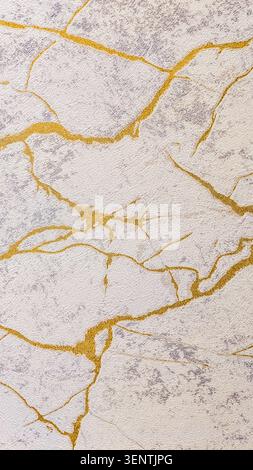 Luxury marble texture with elegant golden veins on a soft white and light gray surface. Premium vertical 8K background for smartphone wallpapers Stock Photo