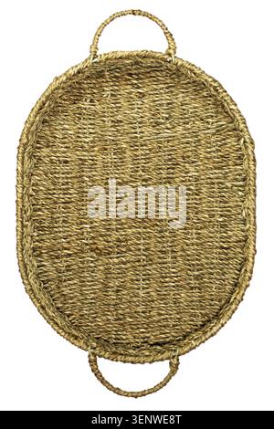 Wicker brown oval basket with handles isolated on a white background. Top view. Selective focus. Handmade product, craft. Close-up. Stock Photo