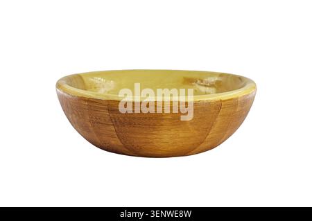 Empty round deep plate made of wood isolated on a white background. Simple wooden tableware made of natural material. Side view. Close-up. Selective f Stock Photo