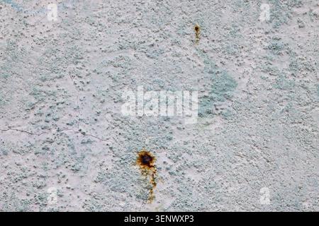 Weathered Concrete Wall Texture with Rust Marks and Cracks Stock Photo