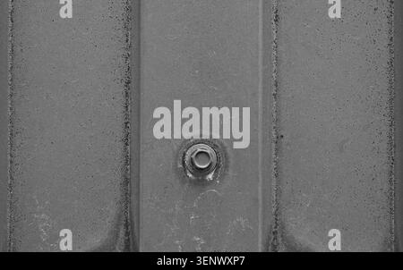 Industrial Metal Texture with Central Bolt and Weathered Surface Stock Photo