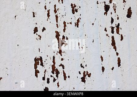 Weathered Rusted Metal Surface with White Peeling Paint Texture Stock Photo
