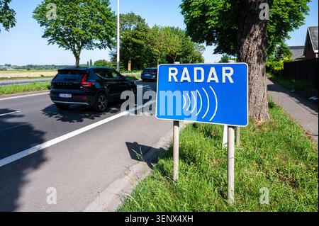 A roadside sign warns drivers of a radar enforcement area and ...