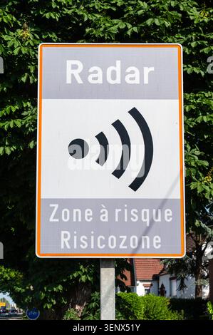 A roadside sign warns drivers of a radar enforcement area and ...