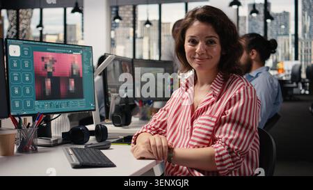 Female agency worker ensuring post production with AI generative software for photo editing content, collaborating with text to image prompts to generate visuals and prepare graphic materials. Stock Photo