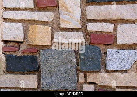 Texture of decorative wall cladding made of colored natural stones Stock Photo
