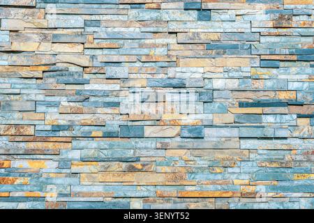 Blue stacked stone wall texture, natural slate blocks and decorative masonry background. Stock Photo