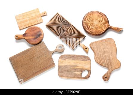 Assortment of wooden cutting boards and serving platters for kitchen and food preparation, isolated on white background Stock Photo