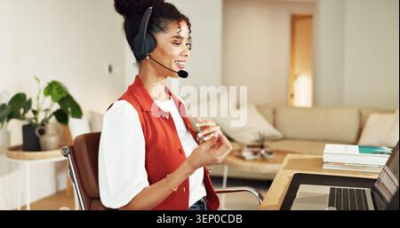 Freelancer, headset and woman in home office with laptop, financial advice or account support. Customer service, remote work or happy person with Stock Photo
