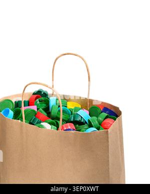 Paper bag full of plastic bottle caps prepared for recycling isolated on white background. Stock Photo