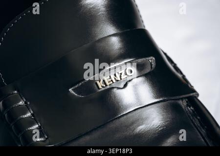 Nice, France - March 1, 2026: Close-up view of Kenzo logo detail on black leather loafer shoe, showcasing luxury fashion design, premium materials and Stock Photo