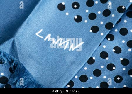 Nice, France - March 1, 2026: Close-up of a Lanvin silk scarf with blue polka dot pattern, showcasing luxury fashion design and textile craftsmanship Stock Photo