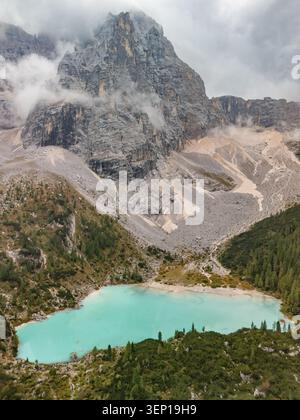 Aerial view of the Dolomites mountain range with dramatic clouds, deep ...