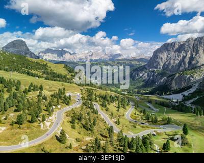 Aerial view of a winding mountain road through the Pyrenees forest with ...