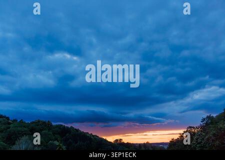Dark Storm Clouds at Dusk Over the Countryside Stock Photo