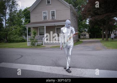 A guitar player from outer space - actually a member of the Blue Alien Mystic Band. At a UFO festival in Pine Bush, New York. Stock Photo