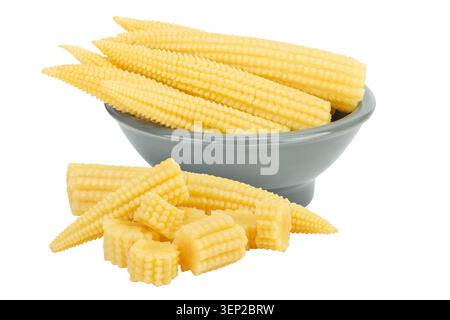 Pickled young baby corn cobs in ceramic bowl isolated on white background Stock Photo