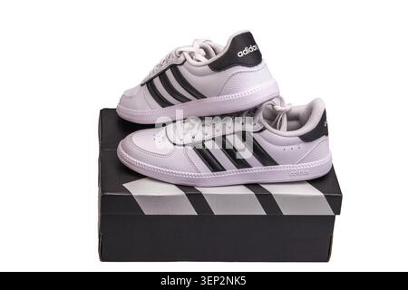 Close up view of Adidas white sneakers on shoe box isolated on white background. Sweden. Stock Photo