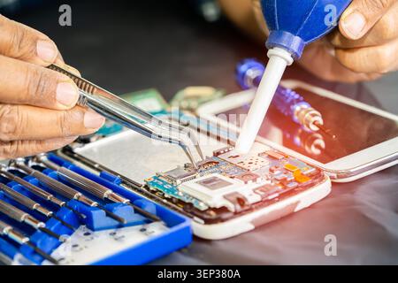 Repairing and upgrade circuit mainboard of notebook, electronic, computer hardware and technology concept. Stock Photo