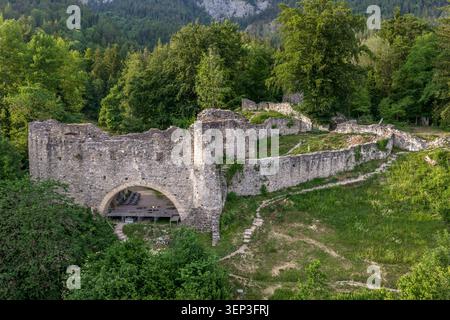 Close low-angle aerial view of Burgruine Thaur in Tyrol, Austria, capturing the architectural detail of this medieval ruin: the surviving arched gatew Stock Photo