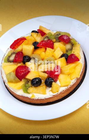 Fresh fruit tart in a white plate Stock Photo