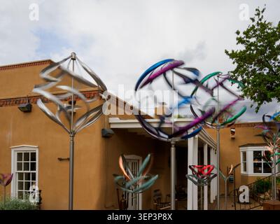 Santa Fe, NM - May 6 , 2026 - Mark White displays his kinetic wind mobiles outside his studio on Canyon Road Stock Photo
