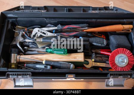 Open toolbox filled with hand tools for home improvement and repair work Stock Photo