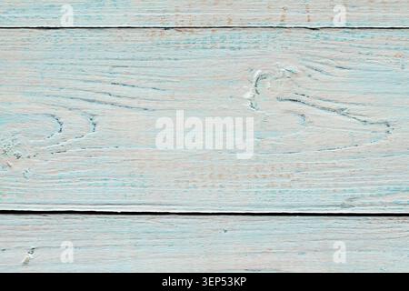 Weathered wooden planks with peeling turquoise paint for rustic shabby chic background Stock Photo