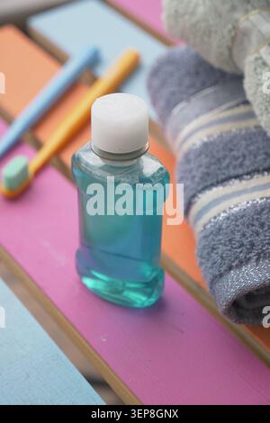 Mouthwash and dental tools on a colorful surface Stock Photo