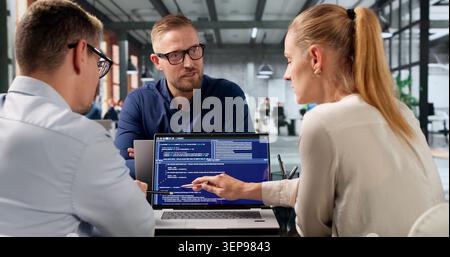 Diverse Group Of Software Engineers Works Together Developing Secure Web Applications. Stock Photo