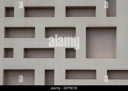 A figured concrete wall in a gray shade. Background Stock Photo