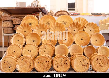 Uzbekistan, Tashkent, Alay Bazaar. Traditional Uzbek flatbread displayed at a local bazaar. Concept: Travel and tourism in Central Asia Stock Photo