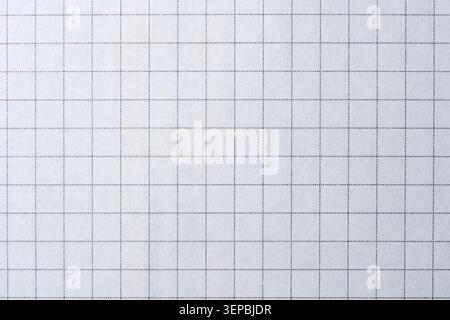 Blank white grid paper awaits sketches, notes, or plans with endless potential. Stock Photo