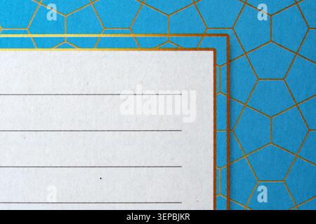 Bright blue backdrop featuring hexagonal shapes and a blank note area invites creativity. Stock Photo