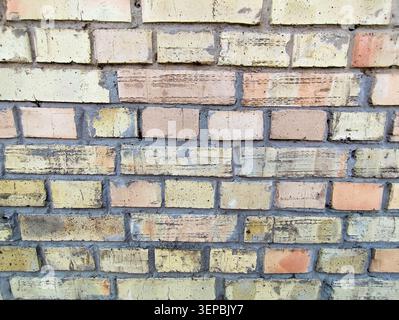 Horizontal Texture of Antique Weathered Brick Wall with Multi-colored Blocks Background. Stock Photo