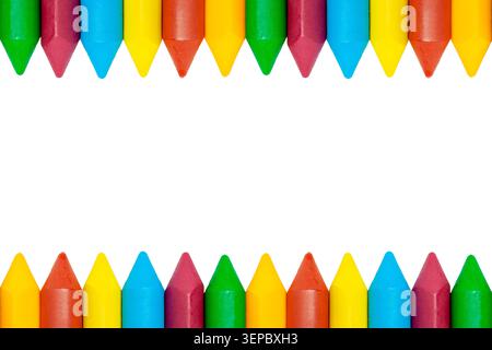 Horizontal top and bottom border frame of colorful wax crayons isolated on clean white copy space background template Stock Photo