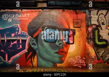 Graffiti Portrait of a woman wearing glasses - Leake Street Arches - London Stock Photo