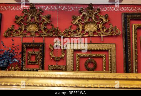 rocaillie or coquille Antique Rococo Louis XV picture frame crests on a wall. Stock Photo