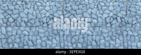 Irregular gray stones forming a robust wall with a natural, uneven surface Stock Photo