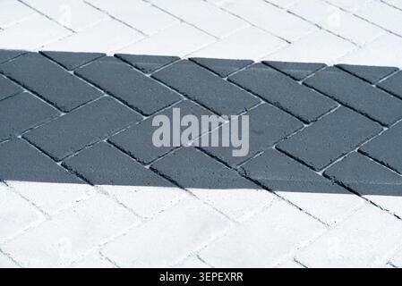 Herringbone pattern on a paved surface The Concept of urban design Stock Photo