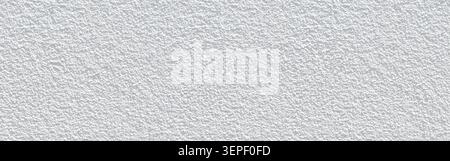 White rough plaster wall surface creating a textured background Stock Photo