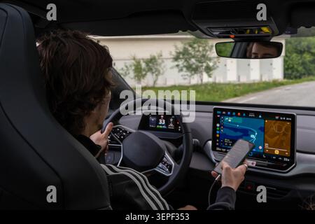 Driver Using Smartphone While Driving Stock Photo