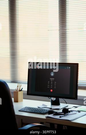 Vertical of office workstation displaying customer voice call interface, supporting call center service, client communication, help desk workflow. For customer support, CRM, contact center marketing Stock Photo