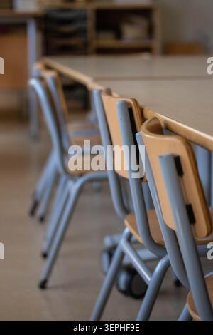Row Of Chairs And Desks In Empty Classroom Stock Photo
