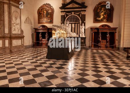 Interior view of a cathedral treasury displaying a golden reliquary chest on a checkered floor, Maastricht Stock Photo