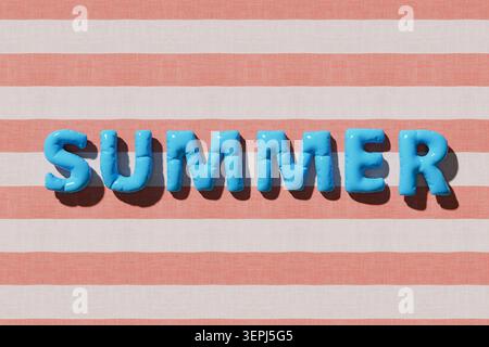 Inflatable blue letters spelling summer resting on a light red and white striped fabric, creating a holiday concept Stock Photo