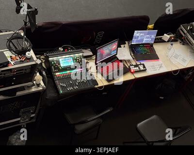 event production setup with audio mixing console and laptops for live events concept. Stock Photo