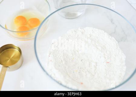 Baking ingredients for a cake on marble countertop Stock Photo